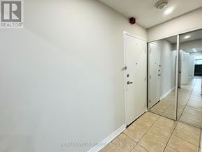 Mississauga (Malton) condo for rent - A white door with a mirror on the wall.