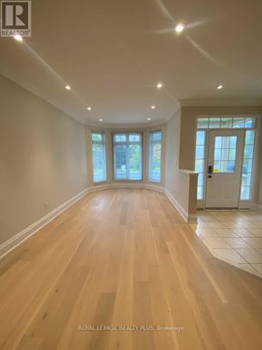 Markham (Greensborough) apartment for rent - A spacious room with wooden floors and white walls.
