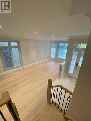 Markham (Greensborough) apartment for rent - A wooden staircase with a metal railing leads to a second floor.