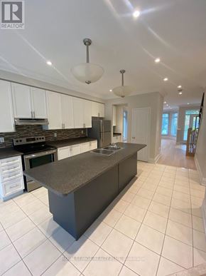 Markham (Greensborough) apartment for rent - A modern kitchen with a large island in the middle.