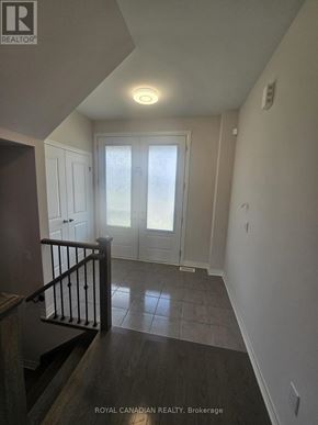 North Dumfries apartment for rent - A hallway with a staircase and a door.