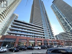 Toronto (Mimico) condo for rent - A tall building with the letters "LCB" on the front.