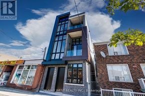 Toronto (Keelesdale-Eglinton West) multi-family for rent - A modern building with a blue and white facade is the focus of this image.