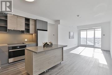 Markham (Commerce Valley) condo for rent - A modern kitchen with a large island and stainless steel appliances.