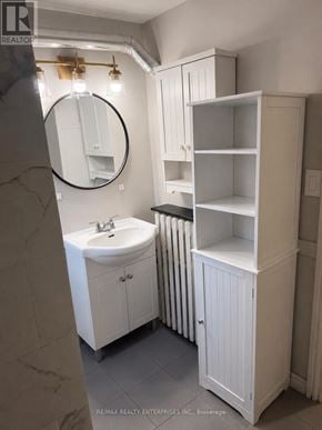Hamilton (Durand) apartment for rent - A bathroom with a sink, mirror, and medicine cabinet.