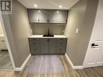 Milton (Wi Willmott) townhouse for rent - A kitchen with a sink and cabinets.