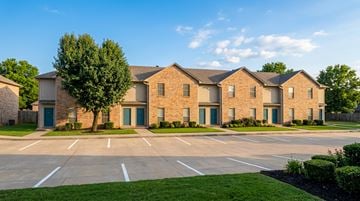 Conway apartment for rent - A row of houses with blue doors and windows.