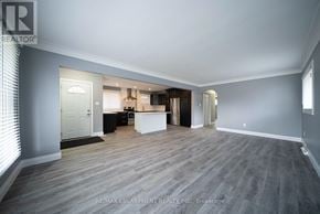 Cambridge apartment for rent - A spacious room with a grey floor and white walls.