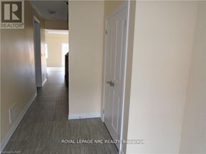 Thorold (Rolling Meadows) townhouse for rent - A hallway with a door on the right and a door on the left.