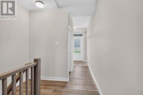 Ottawa townhouse for rent - A long hallway with a door at the end.