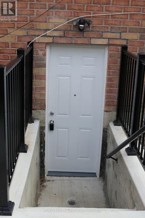 Brampton (Northwest Sandalwood Parkway) apartment for rent - A white door is closed and has a black handle.