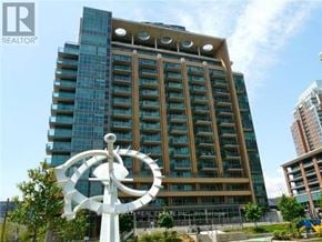 Toronto (Niagara) condo for rent - A tall building with a sign that says REALTOR in front of it.