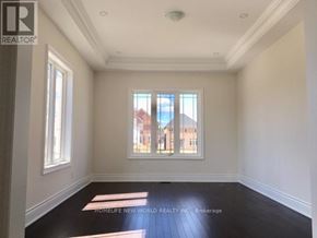 Richmond Hill (Oak Ridges) apartment for rent - A room with a window showing a view of a building outside.