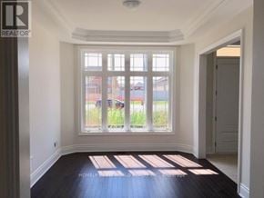 Richmond Hill (Oak Ridges) apartment for rent - A room with a large window and a wooden floor.