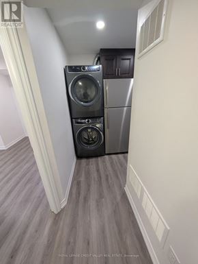 Brampton (Bram East) apartment for rent - A Royal LePage credit valley real estate sign is on the wall.