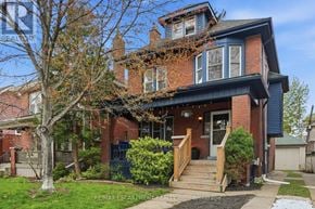 Hamilton (Stipley) apartment for rent - A house with a red brick exterior and a blue trim.