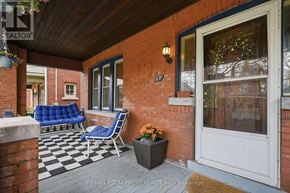 Hamilton (Stipley) apartment for rent - A red brick house with a blue chair and a black and white checkered floor.