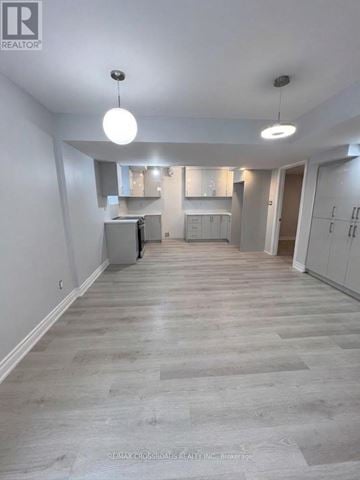 Ajax (Northwest Ajax) apartment for rent - A spacious room with a kitchen area in the background.