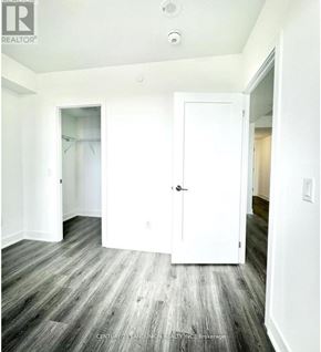 Oshawa (Windfields) condo for rent - A room with a white door and a grey floor.