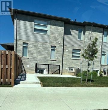 Pelham (Fonthill) townhouse for rent - A building with a sign that says REALTOR in the corner.