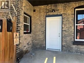 Brantford apartment for rent - A sign on a door reads "A is for Alley.".