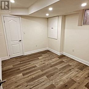 Brampton (Bram East) apartment for rent - A room with a white door and a wooden floor.