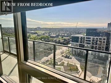 Oakville (Jm Joshua Meadows) condo for rent - A view from a bedroom window looking out at a cityscape.