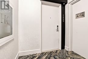 Toronto (Mimico) condo for rent - A hallway with a door and a sign on the wall.