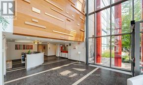 Toronto (Downsview-Roding-Cfb) condo for rent - A realtor photo of a home interior with a reception desk and a large window.