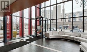 Toronto (Downsview-Roding-Cfb) condo for rent - A realtor's office with a large window view and a black and white carpet.