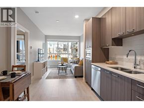 Tsawwassen apartment for rent - A modern kitchen with a dining table and chairs.