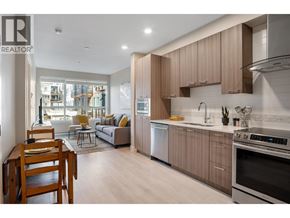 Tsawwassen apartment for rent - A modern kitchen with wooden cabinets and stainless steel appliances.