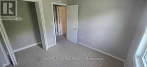 Kingston (City Northwest) townhouse for rent - A brokerage room with a door and a window.
