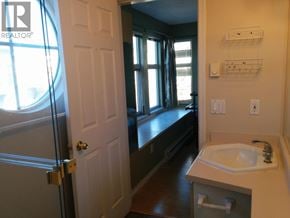 Richmond townhouse for rent - A bathroom with a white sink and a white door.