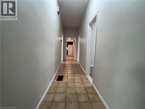 Brantford apartment for rent - A long hallway with a door at the end.