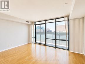 Toronto (Bay Street Corridor) condo for rent - A room with a large sliding glass door leading to a balcony.