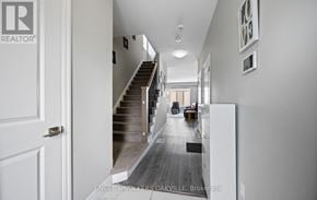 Woodstock (Woodstock - North) townhouse for rent - A hallway with a staircase leading to the second floor.