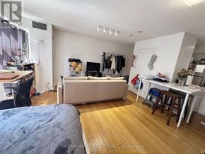 Toronto (Bay Street Corridor) condo for rent - A bedroom with a bed, desk, and closet.