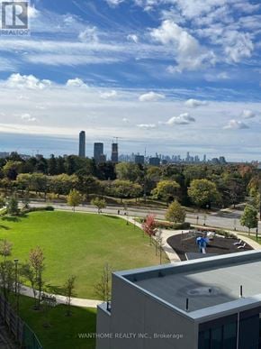 Toronto (Banbury-Don Mills) condo for rent - A real estate company's brokerage office overlooks a city skyline.
