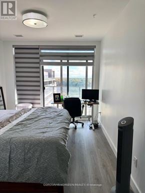 Cambridge condo for rent - A bedroom with a bed, desk, and chair.