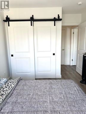 Cambridge condo for rent - A room with a rug and a sliding door.