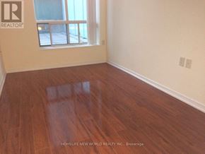 Toronto (Willowdale East) condo for rent - A room with wooden flooring and a window.