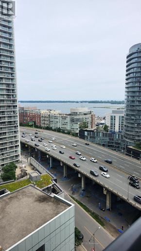 Toronto (Waterfront Communities) condo for rent - A highway with multiple lanes of traffic and a bridge over it.