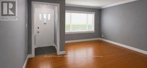 Toronto (Newtonbrook West) apartment for rent - A room with a door and a window with blinds.