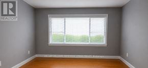 Toronto (Newtonbrook West) apartment for rent - A room with a window and a sign on the wall.