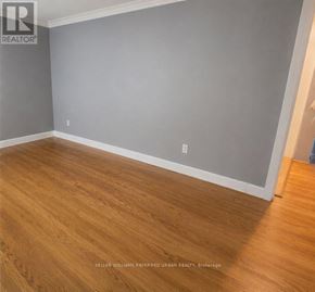Toronto (Newtonbrook West) apartment for rent - A room with wooden flooring and grey walls.