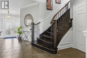 Oshawa (Taunton) apartment for rent - A staircase with a metal railing and wooden steps.