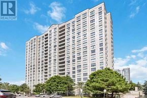 Toronto (Agincourt North) condo for rent - A tall residential building with a clear blue sky in the background.