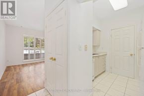 Toronto (Agincourt North) condo for rent - A real estate listing photo of a white room with a door and a window.