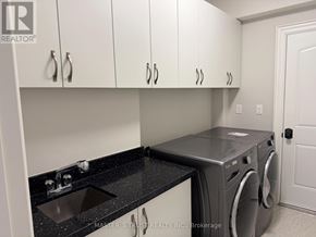 Markham (Grandview) apartment for rent - A laundry room with a washer and dryer.